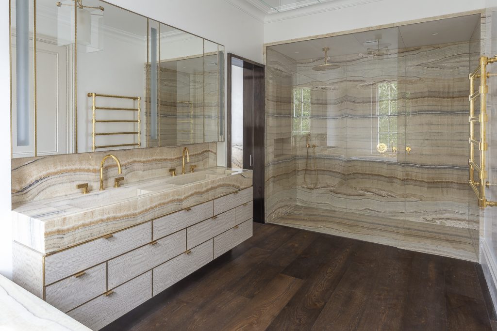 A master bathroom in Velluto Onyx - prized for its warm honey and ivory tones — Lansdowne Crescent, Roma Marble