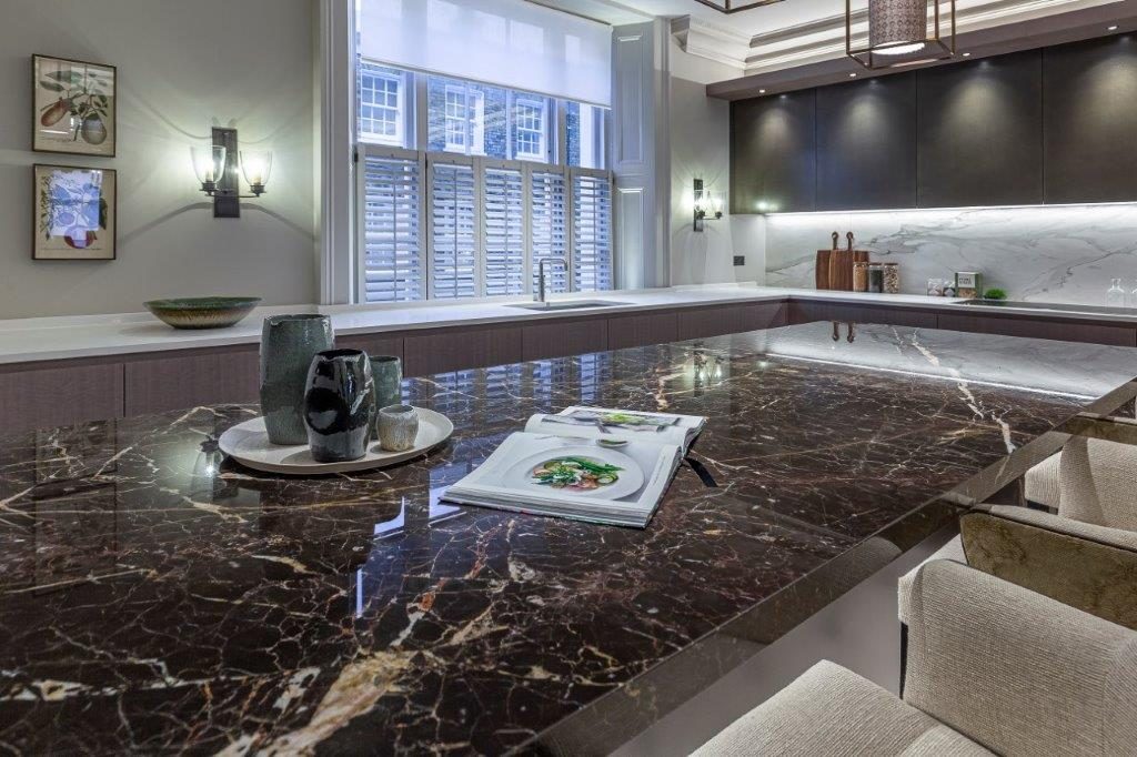 In the kitchen, a Dark Emperador marble island with a mitred downstand as the room's centrepiece — Cornwall Terrace