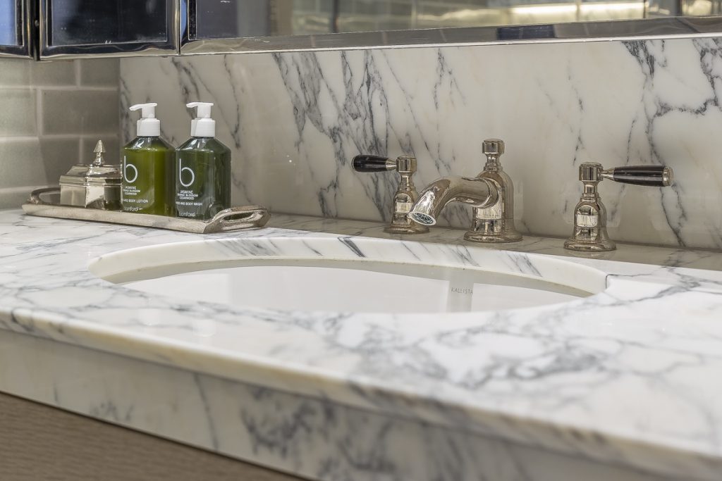 An Arabescato vanity top and splashback, finished with an apex edge profile — Chapel Street, Roma Marble