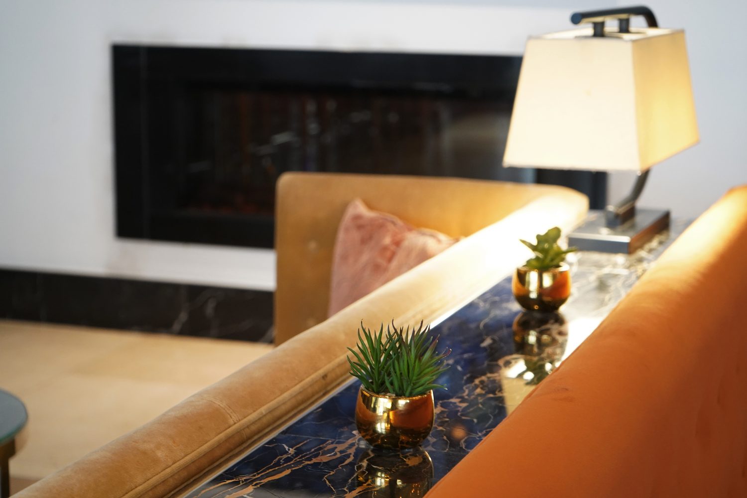 A Portoro Gold marble ledge running behind the lounge banquettes, Blakemore Hyde Park - Roma Marble