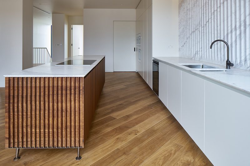 Roma Quartz worktops and splashbacks finished with an apex edge detail — Television Centre, Roma Marble