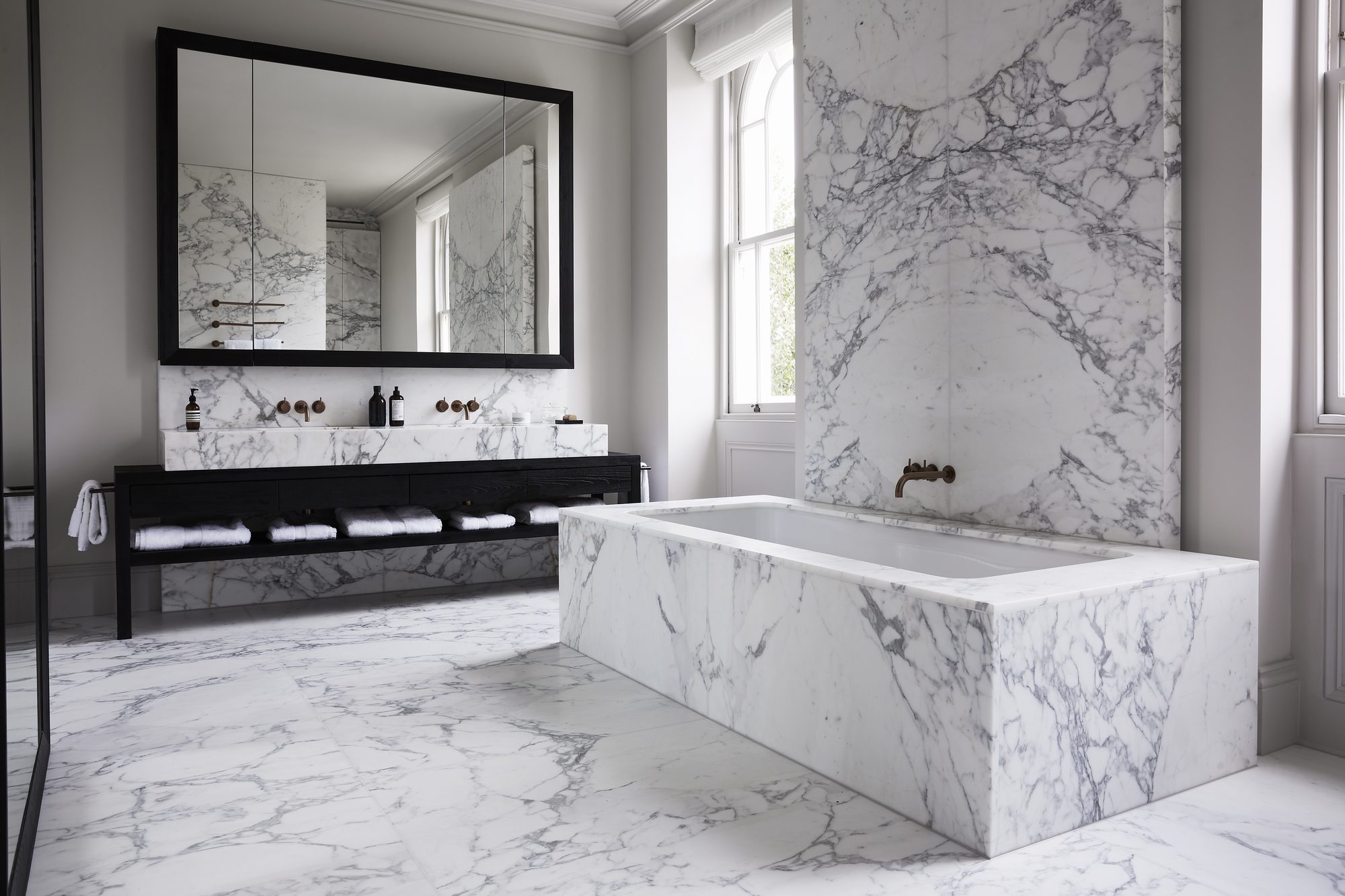 Stone for every space. One standard throughout. — From a single bespoke bathroom to a full multi-storey development