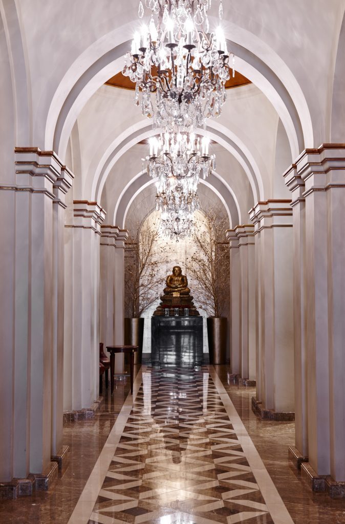 The entrance hall's waterjet-cut floor, combining Light Emperador — Les Ambassadeurs, Roma Marble