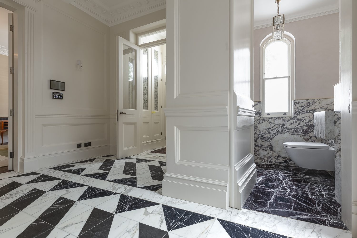 Calacatta Gold & Nero Marquina hallway floor by Roma Marble, London