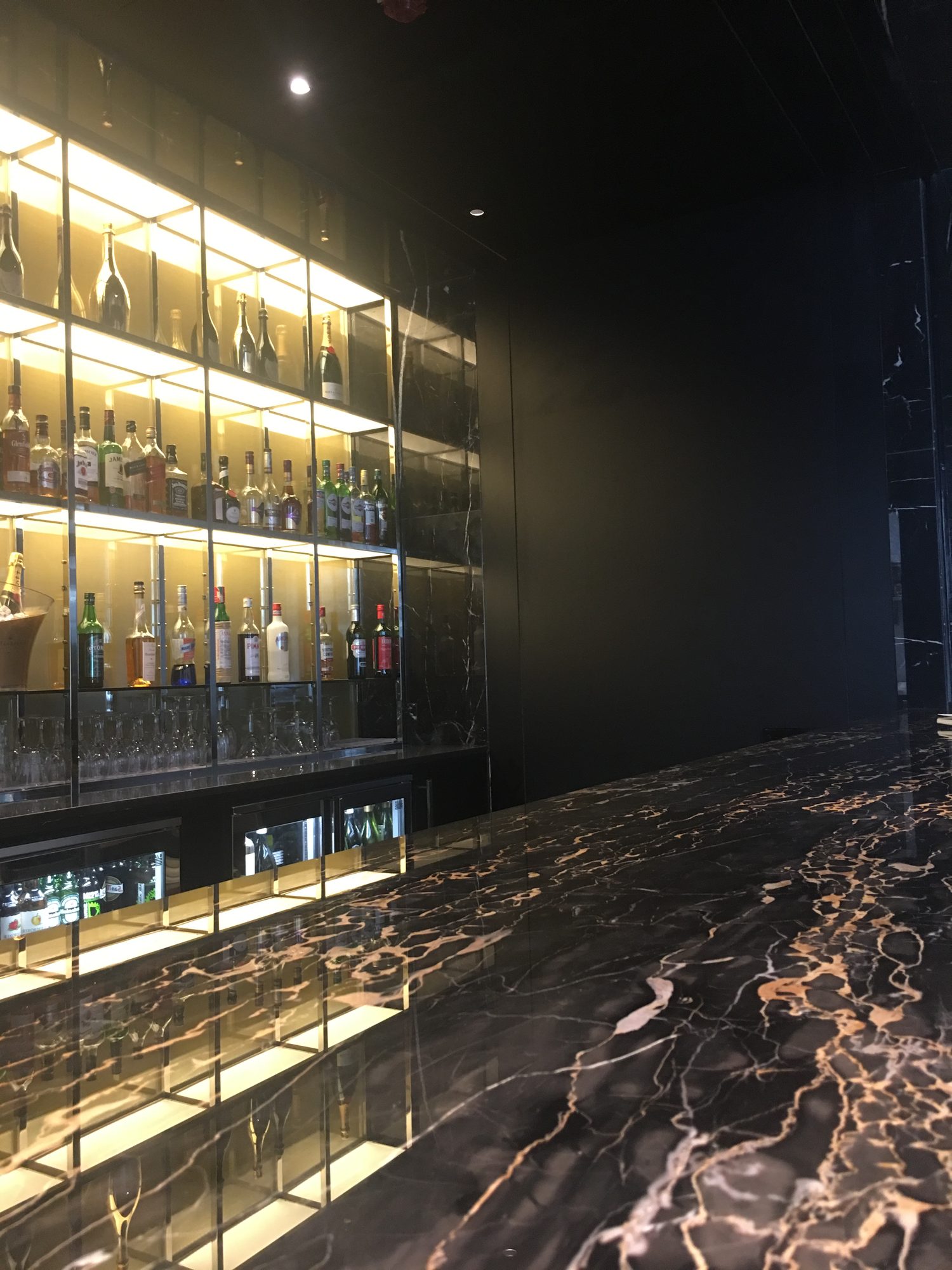 Portoro Gold wine wall by Roma Marble, London