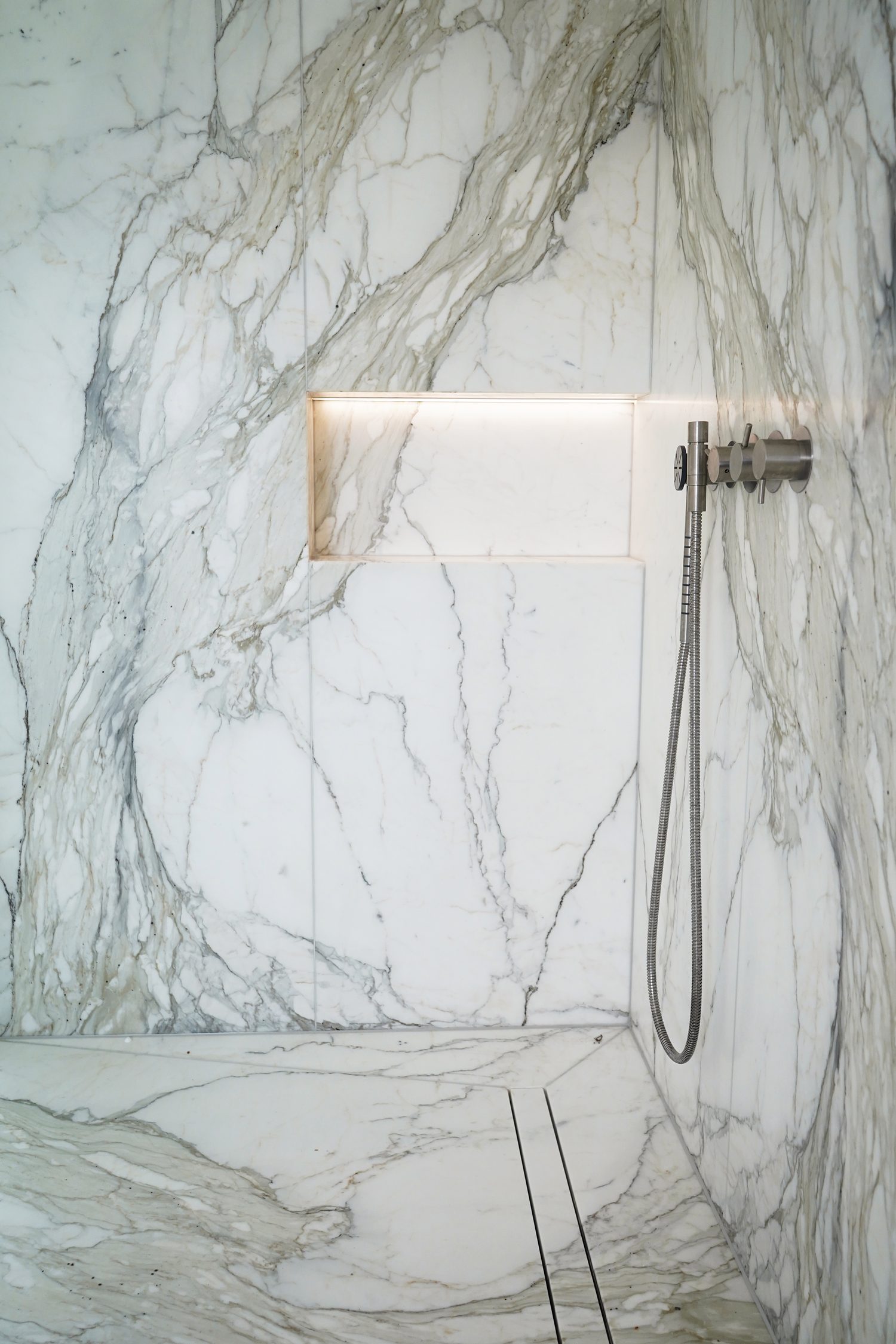 Calacatta Oro run full height in a shower enclosure, Oxford - Roma Marble