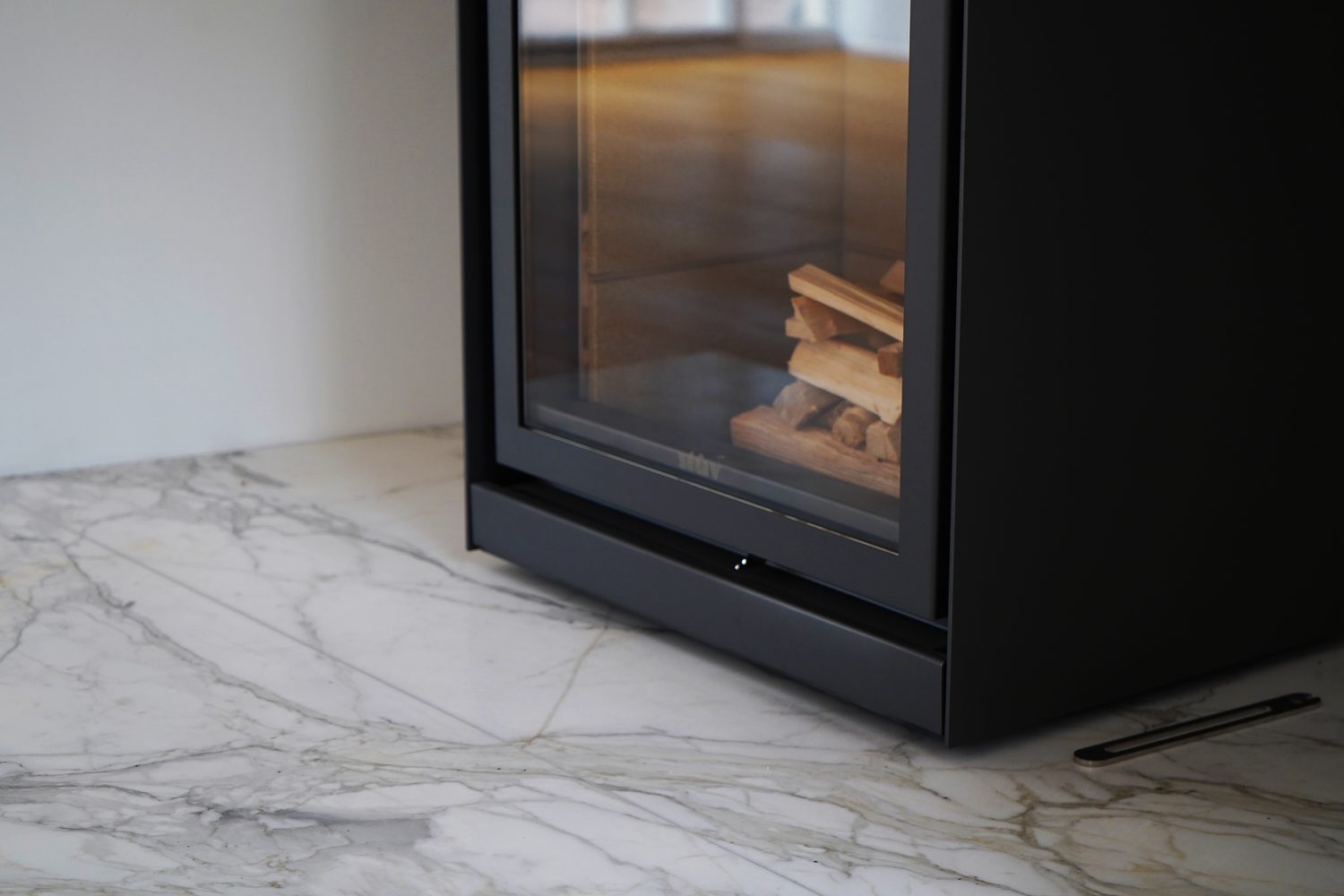 A bespoke Calacatta Oro fireplace with a log burner, Oxford - Roma Marble