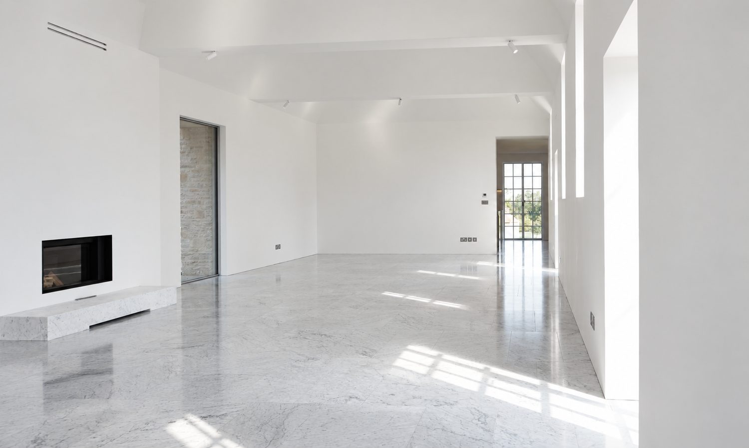 Carrara marble flooring through an open reception room, Oxford - Roma Marble