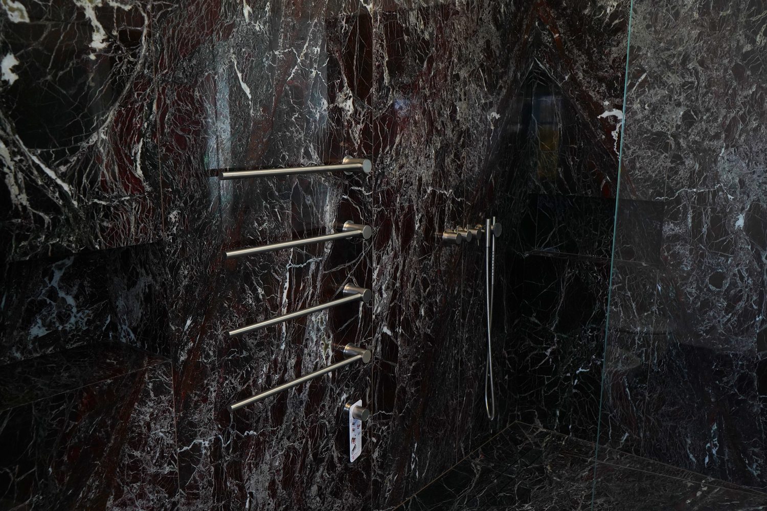 A Rosso Levanto marble shower wall in the master bathroom, Oxford - Roma Marble