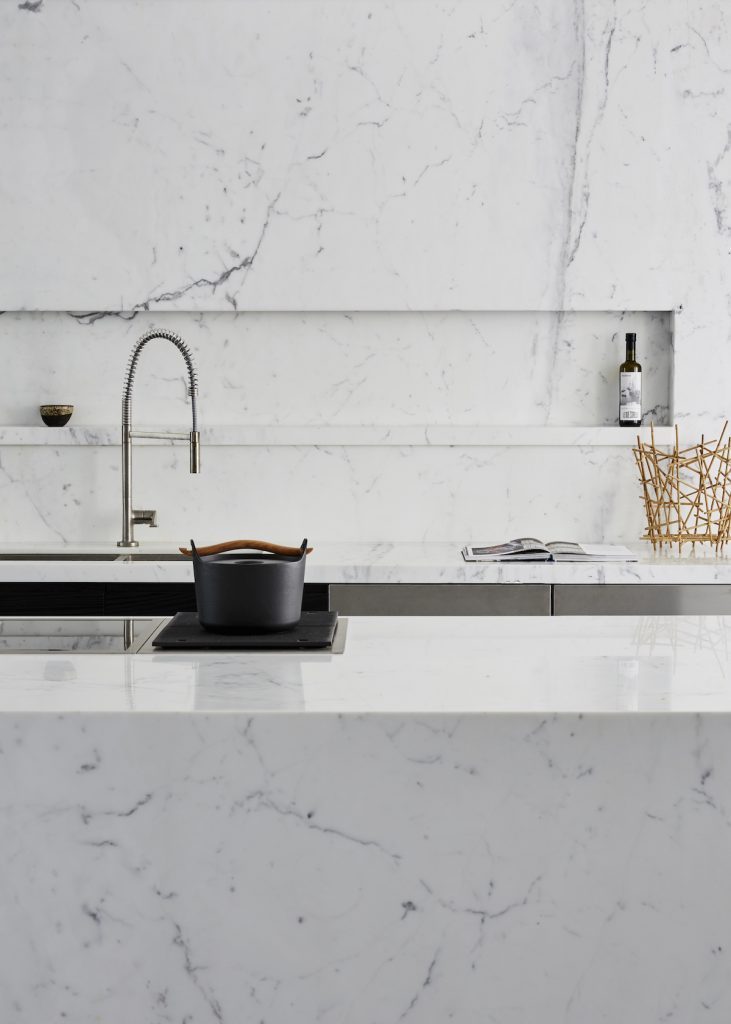 Statuario Venato, carried across each room to keep its grey veining running continuously — Randolf Road, Roma Marble